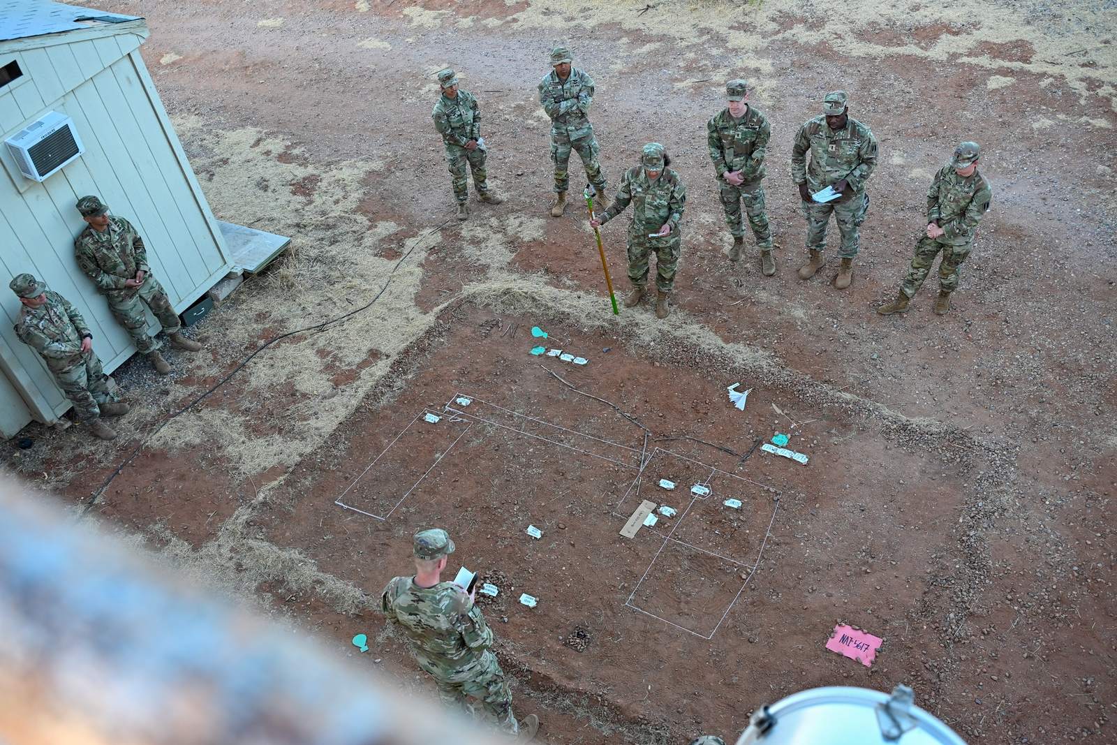 U.S. Army soldiers conduct a terrain-model mission planning briefing during Exercise Arcane Thunder 25 at Fort Huachuca, Arizona